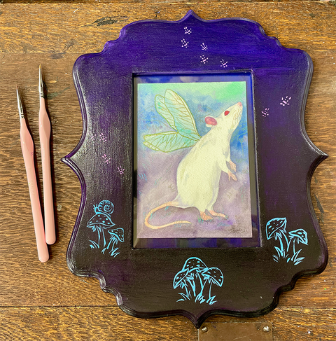 A whimsical watercolor painting of a fairy mouse, representing the exploration of vegan-friendly art supplies for watercolor artists.