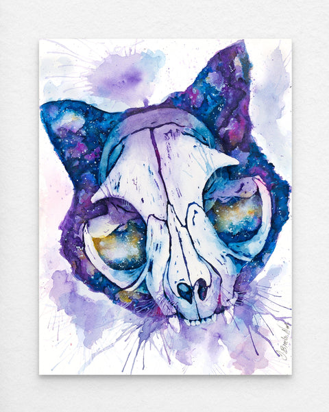 Original watercolor print of a cat skull set against a nebula-inspired background in vibrant blues