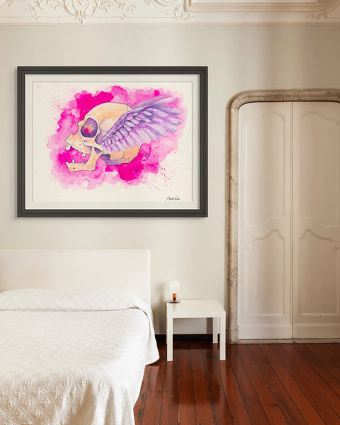 'Freedom' by J. Brooke Wade, an artistic portrayal of a female skull with feather-like wings in vibrant pink hues, set against a magenta backdrop, capturing the essence of feminine empowerment and renewal.